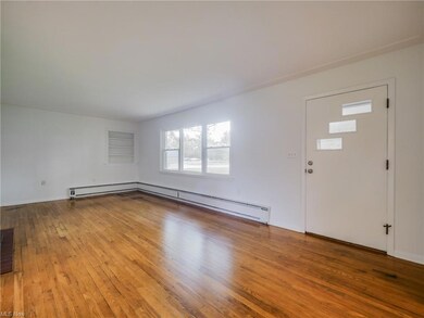 Foyer entrance with a baseboard radiator and light