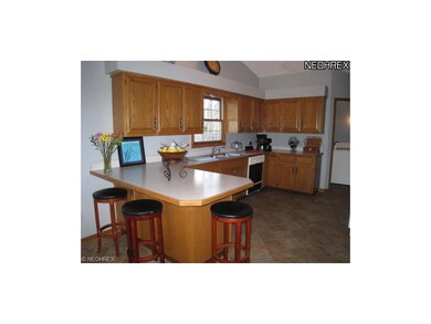 Large, open kitchen with breakfast bar.