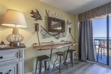 Interior space featuring a water view and hardwood