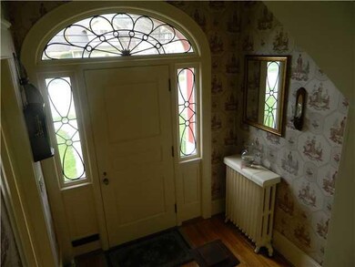 Foyer. Beautiful leaded glass adornment to the fro