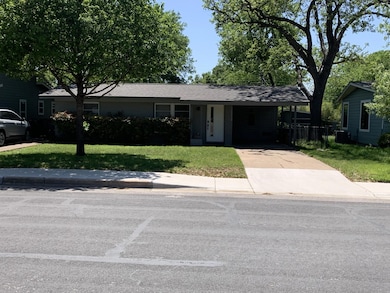 Ranch-style home featuring concrete driveway, an 