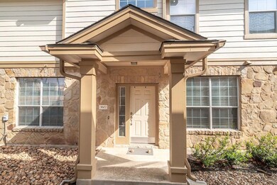 Doorway to property featuring stone siding