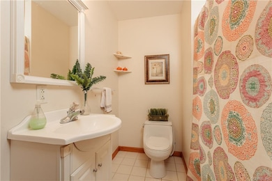 Main bathroom is shown here with ceramic tile floo