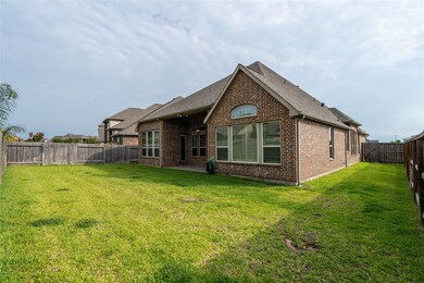 Nice size backyard with lots of windows and a cove