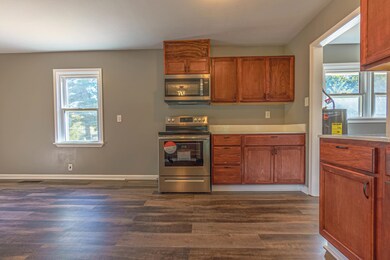 Kitchen featuring electric water heater, stainless