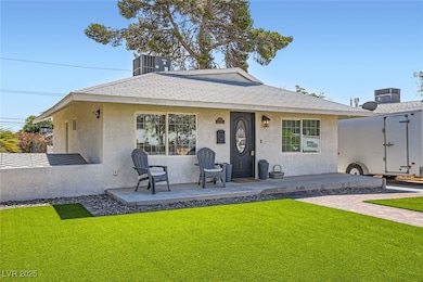Bungalow-style house featuring stucco siding, a fr