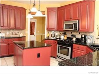 It has been updated with granite countertops, tile