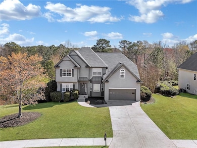 Traditional-style home featuring a garage, stucco 