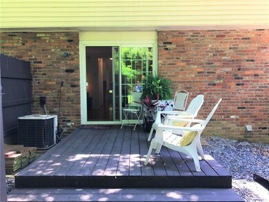 Patio with privacy fence and gate to rear yard