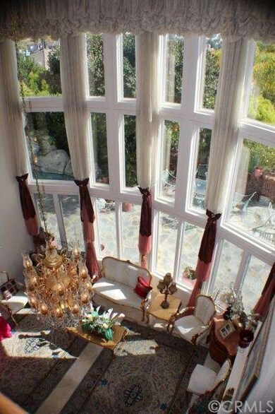 soaring windows with custom made covering opens to