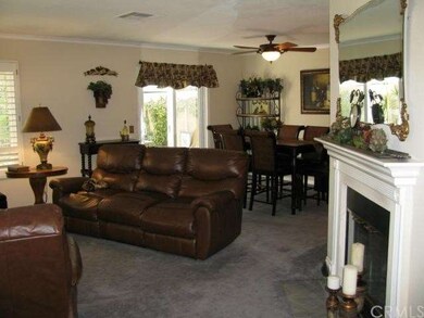 Open plan Living Room w/ fire place adjacent to Di