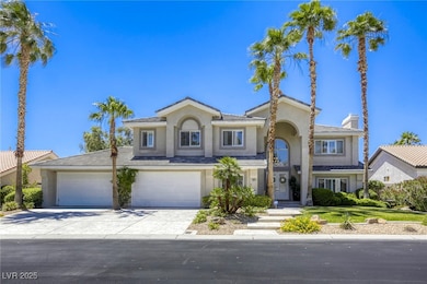 View of front facade with stucco siding, concrete driveway, a chimney, and a garage