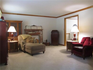 Living Room with crown molding and arch into Forma