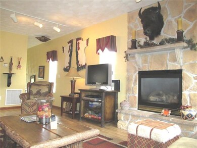 The faux stone faced fireplace is gas and turns of