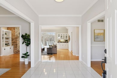 Foyer opens up to spacious dining, living and family rooms area