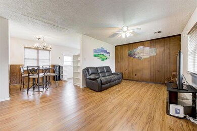 Living room with view into the dining room.
