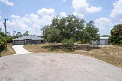View of front facade with a garage and a front law