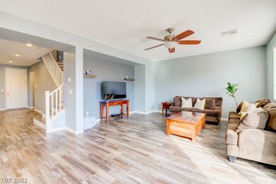 Living room and open foyer and staircase to second