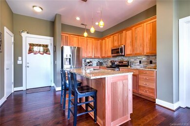 Beautifully appointed kitchen with eat-in island