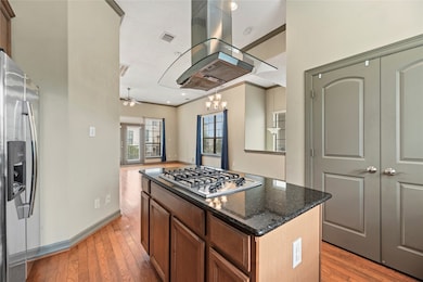 The kitchen features a convenient cooktop seamless