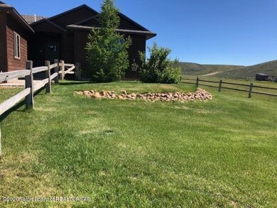 Another view of fenced in yard