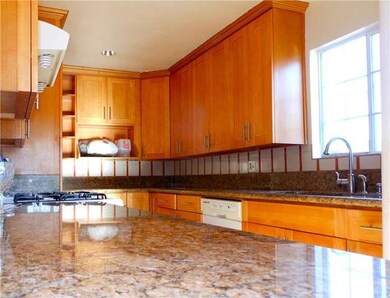 Granite counters in kitchen with beautiful cabinet
