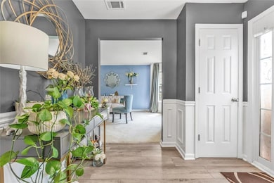 Entryway with wood finished floors