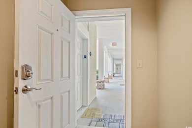 Hallway with light carpet
