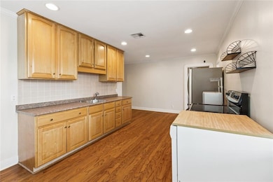 Kitchen has stainless- steel appliances including