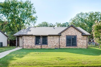 Ranch-style house with a front lawn