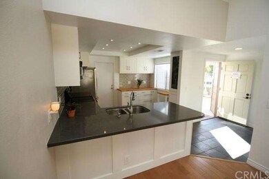 Attached 2-Car Garage leads into kitchen (at cente