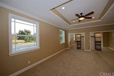 Master bedroom with beveled mirror closet doors an