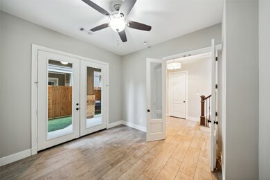 This bright room features wood-look tile flooring,