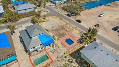 Cleared lot with pool at corner of Lazy Way & Easy