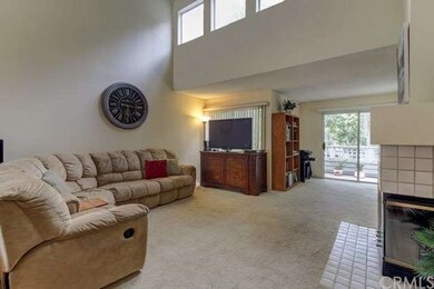 Living room with vaulted ceilings and plenty of na