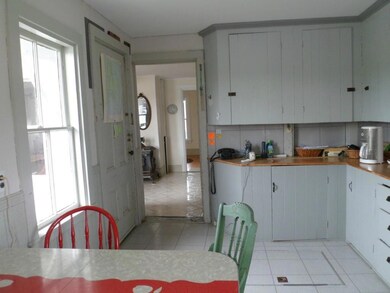 Kitchen looking into living area and...