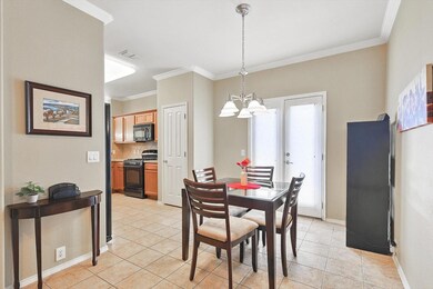 Tiled Breakfast Nook room with ornamental molding