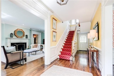 This central front to back foyer is the heart of t
