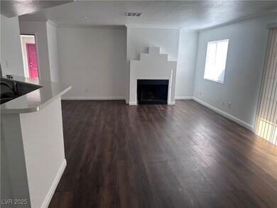 Unfurnished living room with dark wood-style floor