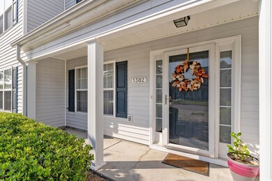 Property entrance featuring covered porch