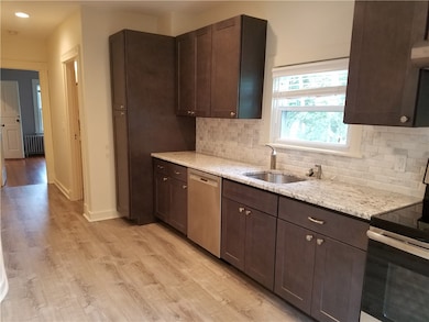 Kitchen view to bedroom and half bath