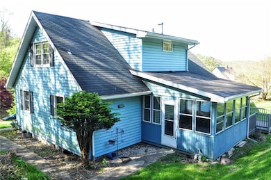 Another view of the sunroom and side of the home
