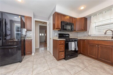 The remodeled Kitchen with granite counters, glass
