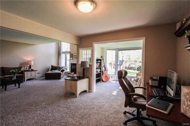 Formal dining area with sun room in the back groun