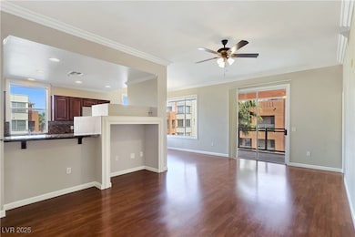 Great Room with Ceiling Fan, Crown Molding, Lamina