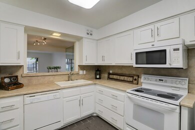 Kitchen opens to living area.
