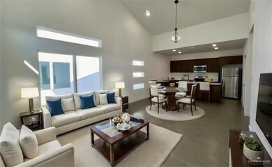 Living area featuring baseboards, high vaulted ceiling, and recessed lighting