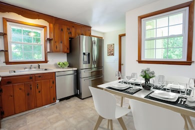 All new appliances in this cool vintage kitchen that has doors to yard, carport and leads to laundry/half bath