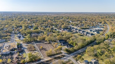 Aerial overview of property's location featuring nearby suburban area