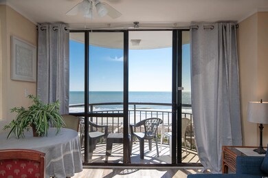 Sunroom / solarium with a water view